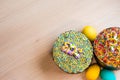 Two Easter cakes and three colored eggs, yellow and blue.  Copy space Royalty Free Stock Photo