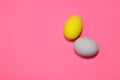 Two easter eggs on pink backround