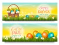 Two Easter Sale banners. Colorful eggs in green grass. Royalty Free Stock Photo