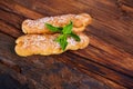 Two eclair decorated with mint Royalty Free Stock Photo