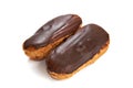 Two eclairs with chocolate glaze isolated Royalty Free Stock Photo