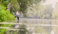 Two ecologist getting samples of water in city park