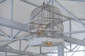 Two Edison light bulbs inside lampshade made from white painted wood bird cage. Closeup of birdcage reused into ceiling lamp Royalty Free Stock Photo