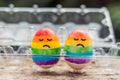 Two eggs are colored in the colors of the rainbow as a flag of gays and lesbians as well as Easter eggs. Homosexual concept Royalty Free Stock Photo