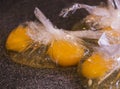 Two eggs in plastic bags for poaching Royalty Free Stock Photo