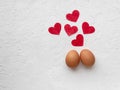 Two eggs with red heart on white background with egg`s shadow Valentines day concept Royalty Free Stock Photo