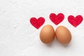 Two eggs with red hearts on white background with Valentines day concept Royalty Free Stock Photo