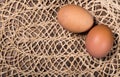 Two eggs on the wattled cloth background