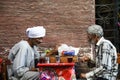 Two elder men playing chess on the street