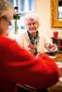 Two elder people playing cards Royalty Free Stock Photo