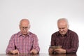 Two men with euro notes and coins Royalty Free Stock Photo