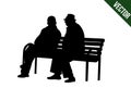 Two elderly people silhouettes sitting on a park bench Royalty Free Stock Photo