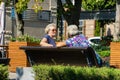 Two elderly women sitting on bench and chatting on beautiful embankment of Rostov-on-Don.