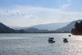 two electric mini boats on ossiacher see lake in summer.