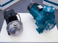 Two electric motorized portable water pumps at hardware store