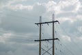 Electric poles beside main road in cloudy Royalty Free Stock Photo