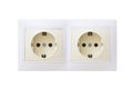 Two electric sockets. Two electrical outlets are beige and white paired. Isolated. Double