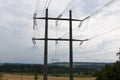 Two electricity pillars of power transmission tower of high voltage electricity viewed in summer day