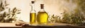 Two elegant bottles of golden olive oil with a rustic background, adorned with olive branches.
