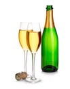 Two elegant champagne glasses on the background of green bottles close-up isolated on a white. Festive still life.