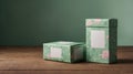 Two elegant gift boxes with floral patterns sit on a rustic wooden surface against a muted green backdrop. Perfect for showcasing Royalty Free Stock Photo