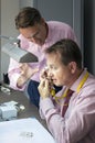 Two elegant man checking quality of diamonds Royalty Free Stock Photo