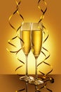 Two elegant perfect glasses filled with sparkling champagne with golden serpentines Royalty Free Stock Photo
