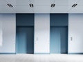 Two elevator doors corridor frontal view with blue accents and white glass panels wall