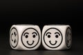 Two emoticon dice with happy expression sketch