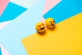 Two emoticon: smiling yellow emoticon with heart eyes, and pirate witheye patch and mustache Royalty Free Stock Photo