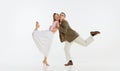 Two emotional dancers in vintage style clothes dancing swing dance, rock-and-roll or lindy hop on white