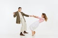 Two emotional dancers in vintage style clothes dancing swing dance, rock-and-roll or lindy hop on white