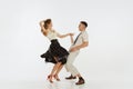 Two emotional dancers in vintage style clothes dancing swing dance, rock-and-roll or lindy hop  on white Royalty Free Stock Photo