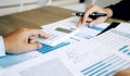 Two employees check the financial statements of the company together in the accounting room Royalty Free Stock Photo