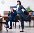Two employees doing sport exercises in the office