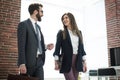 Two employees talking standing in the office Royalty Free Stock Photo