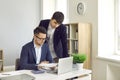 Two employees working in the company office and doing business paperwork together Royalty Free Stock Photo