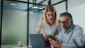 Two employees working together office closeup. Business people discussing work Royalty Free Stock Photo