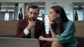 Two employees working together in office closeup. People researching laptop Royalty Free Stock Photo