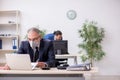 Two employees at workplace during pandemic