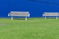 Two empty beanch seats in central city park