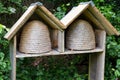 Two empty bee hives