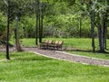 Two Empty Benches Along Park Path Royalty Free Stock Photo