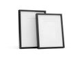 Two empty blank picture frames with dark borders displayed on a clean white background Royalty Free Stock Photo