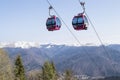 Two empty cable cars climbing