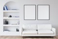 Two canvases on white wall of living room with arched niche shelf Royalty Free Stock Photo