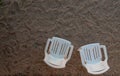 two empty chairs on the sand top view Royalty Free Stock Photo