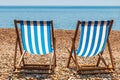 Deck Chairs on Brighton Beach, with a View of the Sea Royalty Free Stock Photo