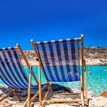 Two empty deck chairs and sea at backgroung Royalty Free Stock Photo