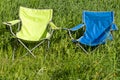 Two empty folding chair on the green grass Royalty Free Stock Photo